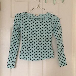 Mint blue polka dotted long sleeve top.